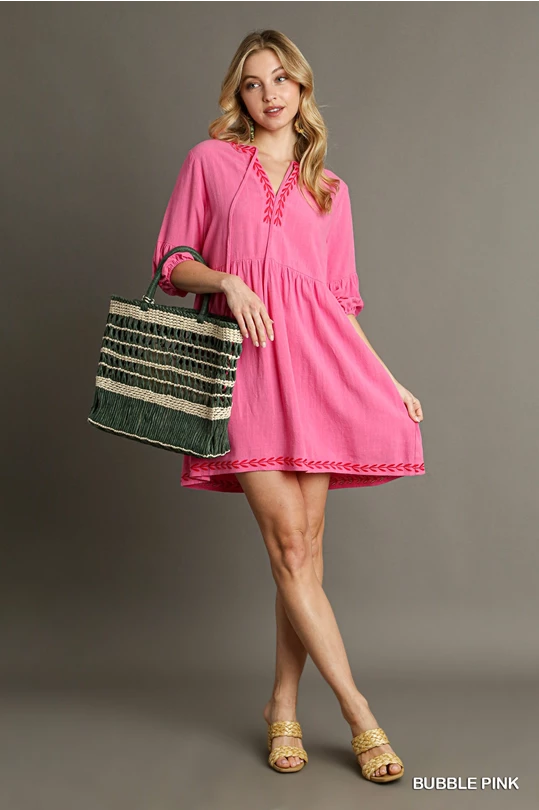 Pink linen dress with embroidered details